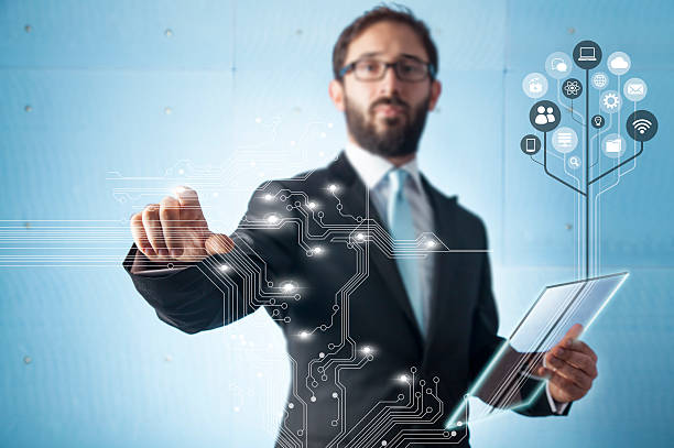 Businessman standing and working with touch screen technology
